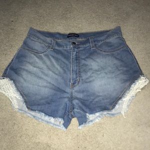 Distressed denim shorts